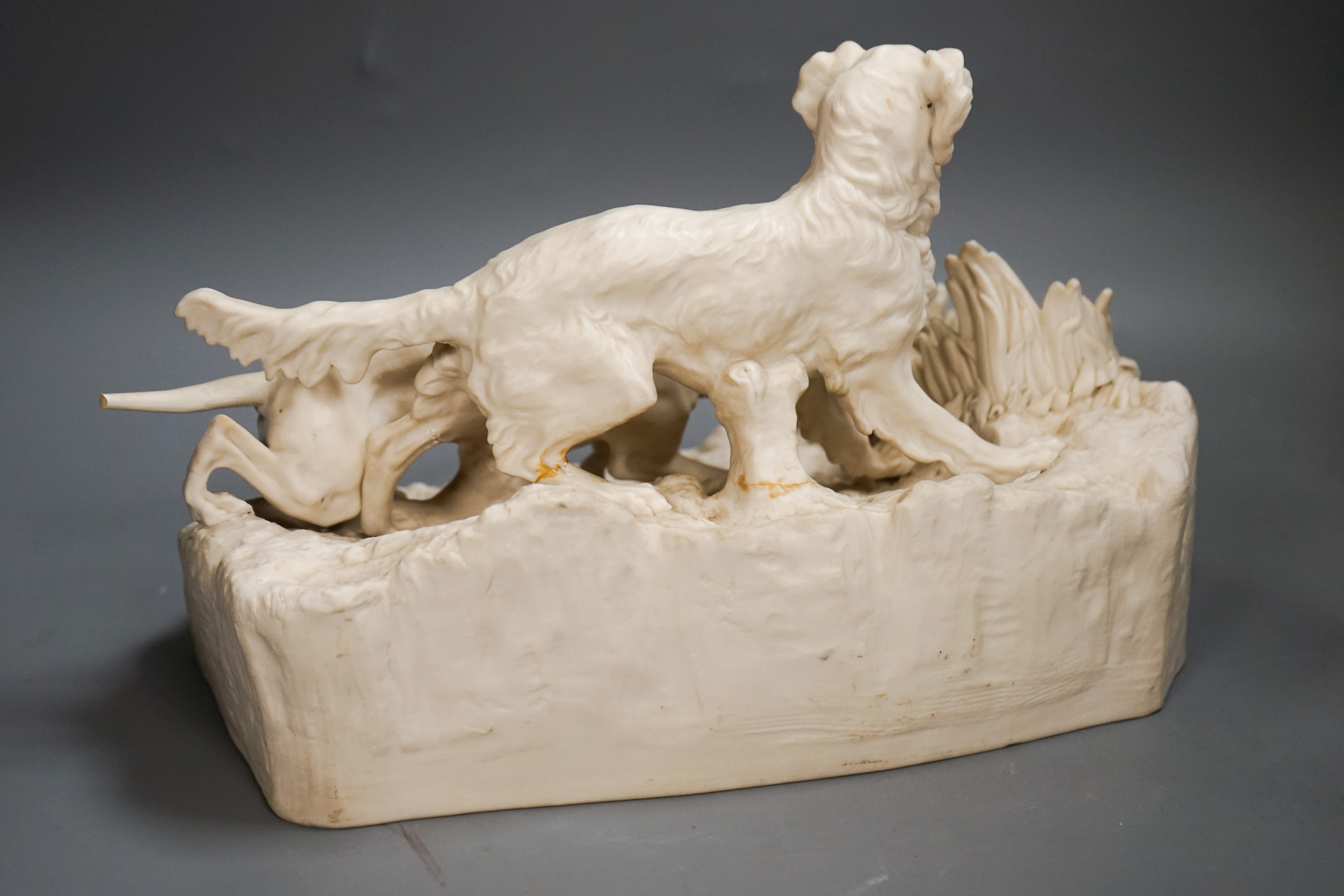 A Victorian parian group of two setters flushing a partridge, after Mene, 32cm (a.f.)